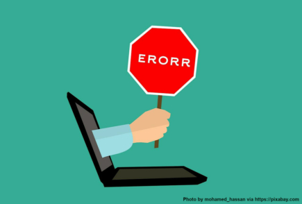 A warning sign coming out of a laptop, saying: ERROR